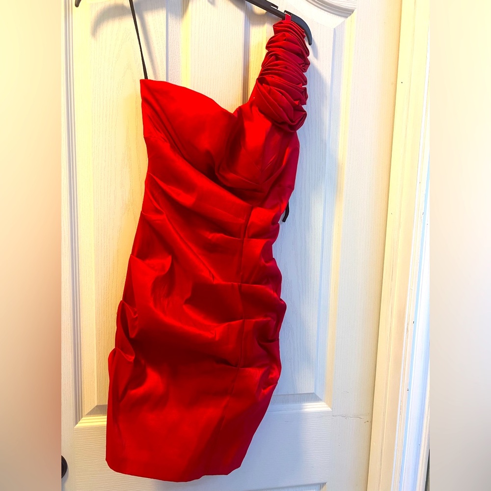 Red dress size medium 
The dress is stretchy to fit body